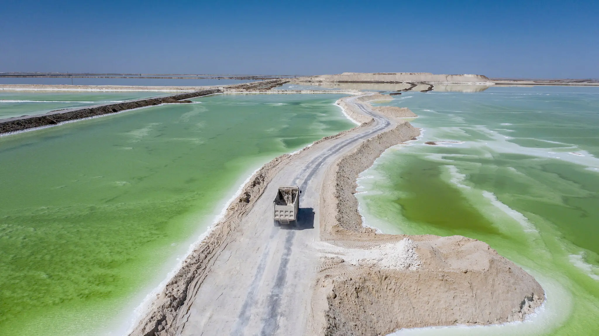 The Chaerhan Salt Lake in western China, a source of lithium, magnesium and potassium. China dominates the refining and processing of lithium and other metals needed to produce electric-car batteries. Credit...Qilai Shen for The New York Times
